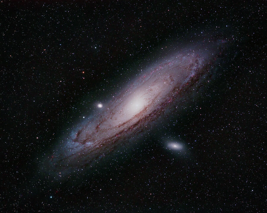 The Andromeda Galaxy, revealing its bright center, spiral structure, and dark dust lanes.
